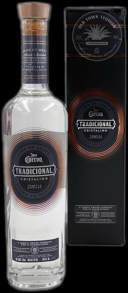 Corona Tradicional Cristalino tequila bottle with black and gold label next to its black gift box packaging