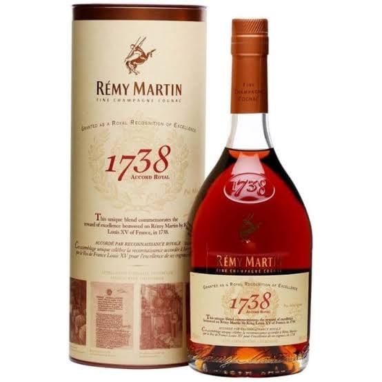 Bottle of Remy Martin 1738 cognac with its cylindrical gift box featuring the brand logo and year 1738