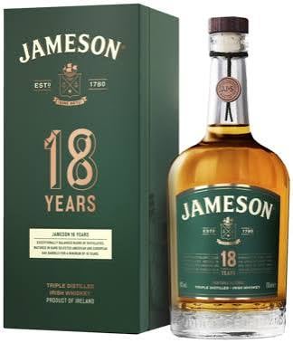 Jameson 18 Years Irish whiskey bottle next to its green box packaging