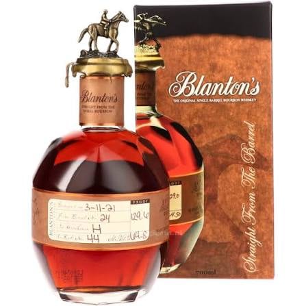 Blantons bourbon whiskey bottle with distinctive horse stopper and matching box packaging