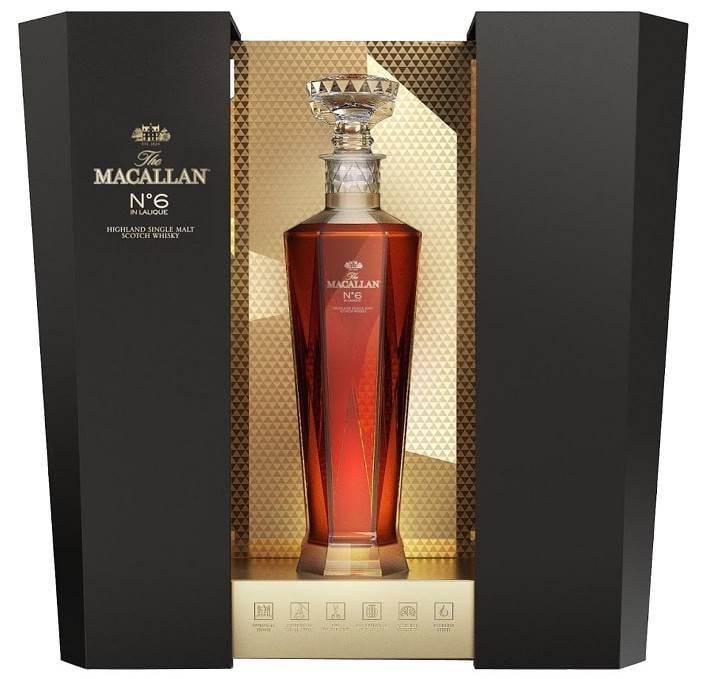 Macallan No. 6 whisky bottle in luxury black presentation box with gold-patterned interior packaging