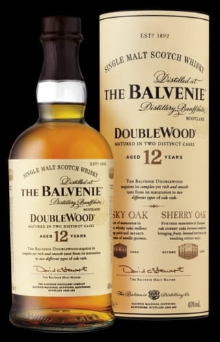 The Balvenie DoubleWood 12 Years aged single malt Scotch whisky bottle with its cylindrical packaging box displayed side by side
