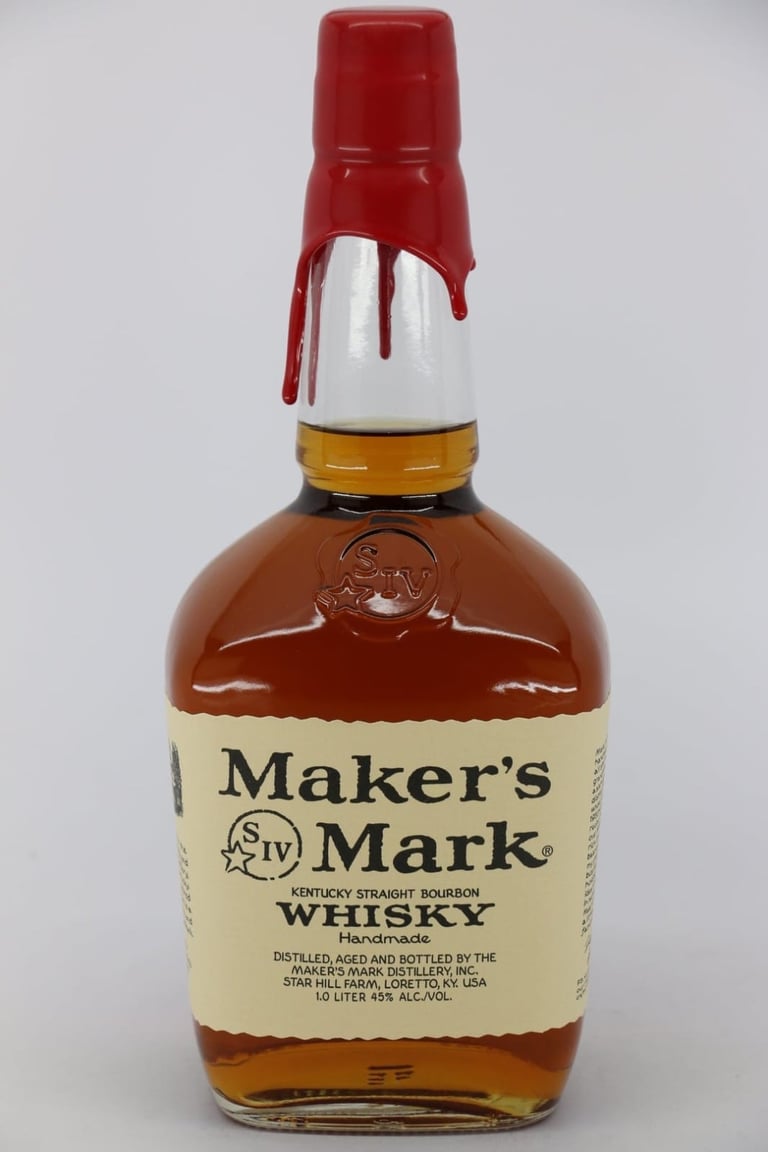 Bottle of Makers Mark Kentucky Straight Bourbon Whisky with red wax seal and cream-colored label