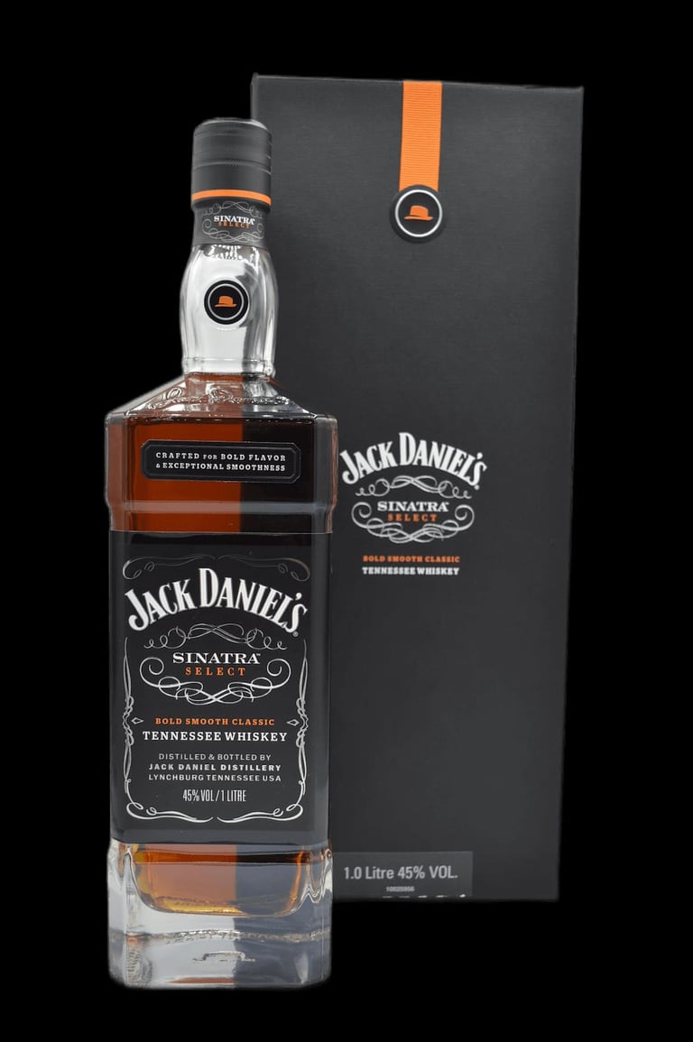 Jack Daniels Sinatra Select Tennessee Whiskey bottle with black label next to matching dark gift box with orange ribbon on black background