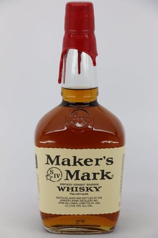 Bottle of Makers Mark Kentucky Straight Bourbon Whisky with red wax seal and white label