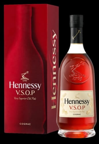 Hennessy V.S.O.P Cognac bottle and red gift box with gold accents on black background