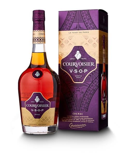 Courvoisier V.S.O.P cognac bottle and purple branded gift box on white background