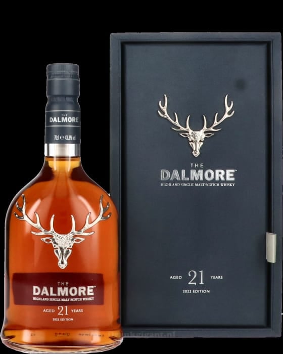 Dalmore 21 year old Highland single malt Scotch whisky bottle with stag logo next to black gift box packaging