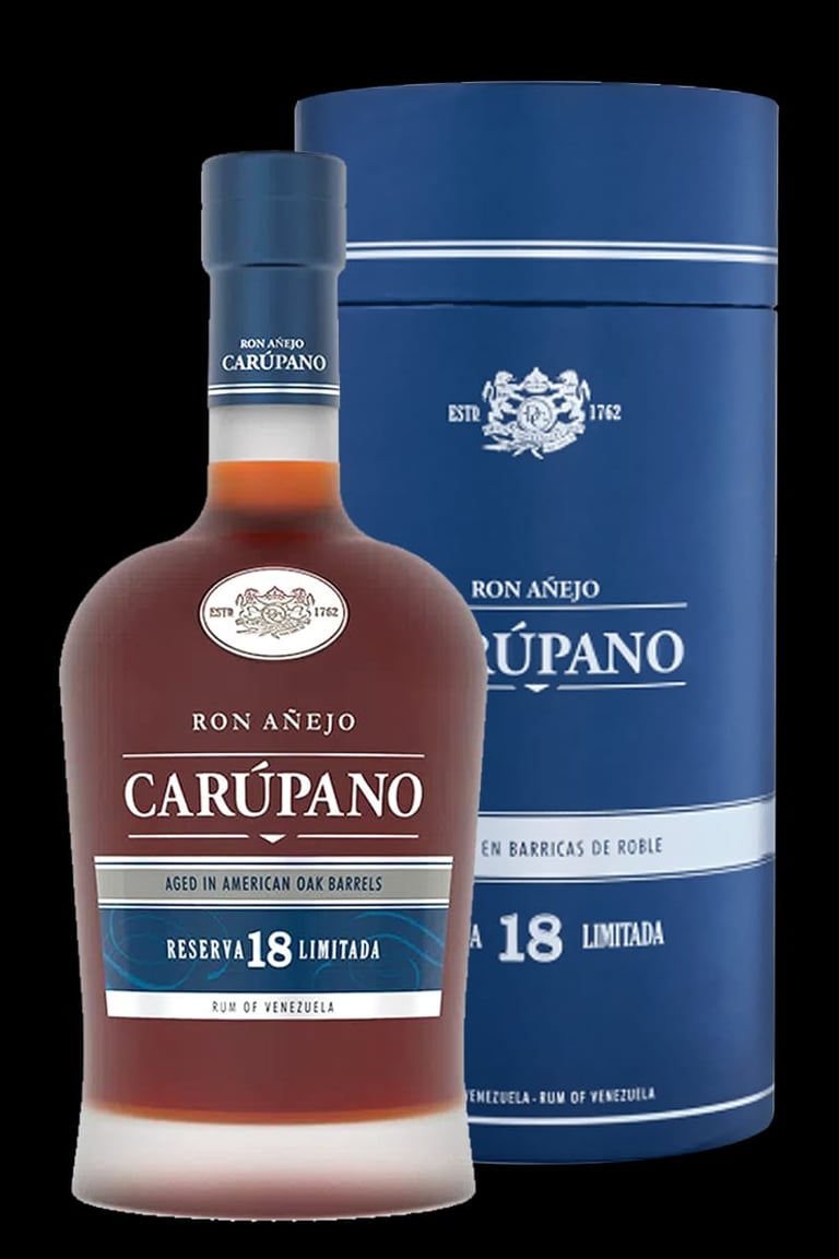 Bottle of Carupano Ron Anejo 18 year aged rum with its blue cylindrical box packaging against a black background