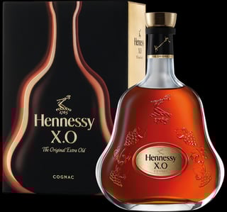 Hennessy X.O cognac bottle with gold cap next to black box packaging featuring curved bottle design