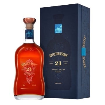 Appleton Estate 21-year-old rum bottle in amber glass with copper stopper next to its dark blue presentation box