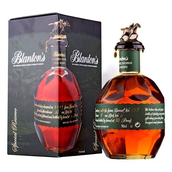 Blantons bourbon whiskey bottle and black box packaging with horse and rider stopper design