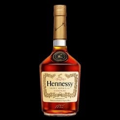 Bottle of Hennessy Cognac with gold cap and label against black background